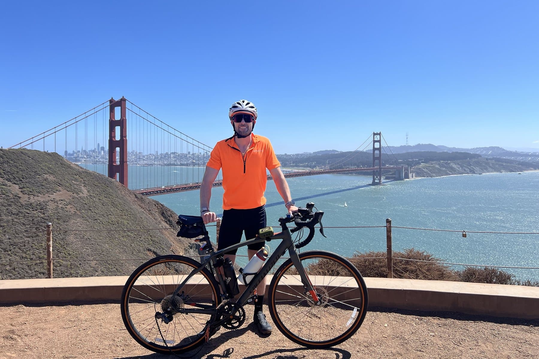 Daniel with his Specialized Diverge at a Marin Headlands overlook, the Golden Gate Bridge and San Francisco behind him